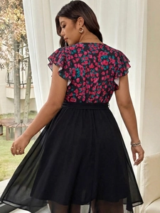 Rear view of floral patchwork maxi dress featuring chiffon fabric and ruffled short sleeves