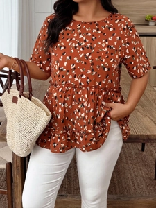 Detail of rust red leopard print blouse with tiered ruffle hem and short sleeves