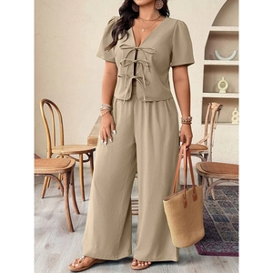 Detail of V-neck top with bow-tie closure and matching khaki wide-leg pants