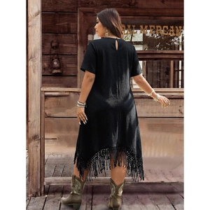 Bohemian black dress with irregular tassel fringe and waffle texture back view