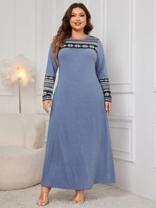 Detail of blue plus size maxi dress featuring ethnic print on neckline and long sleeves