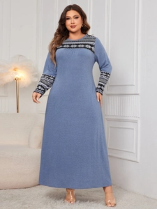 Detailed view of the bohemian jacquard patterns on a plus size sky blue maxi dress