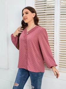Detail of pink Swiss dot chiffon blouse with lace-trimmed V-neck and lantern sleeves