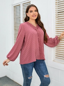 Detail of Swiss dot chiffon blouse in dusty rose with lace trim and v-neckline