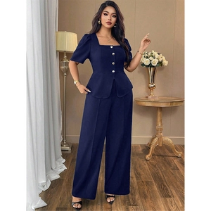 Navy blue two-piece set featuring square neck peplum top and wide leg trousers