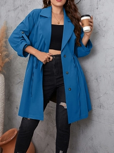 Detail of blue long-line windbreaker featuring drawstring waist and notch lapels