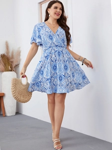Close-up of bohemian blue floral dress with V-neckline and ruffled sleeve detail