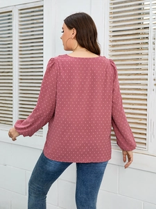 Detail of pink long sleeve Swiss dot chiffon blouse with pleated cuffs and round neck