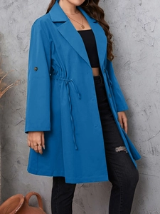 Detail of blue mid-length trench coat with notched lapel and adjustable drawstring waist