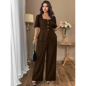 Close-up of square neck puff sleeve top with gold buttons and matching wide leg pants