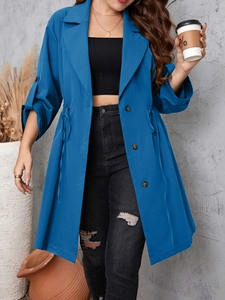 Detail of blue mid-length trench coat with adjustable drawstring waist and button cuffs