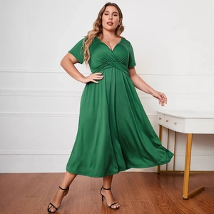 Plus size green short sleeve maxi dress with deep V-neck and twist front detail