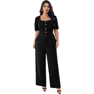 Women's two-piece black set with square neck peplum top and high waist wide leg trousers