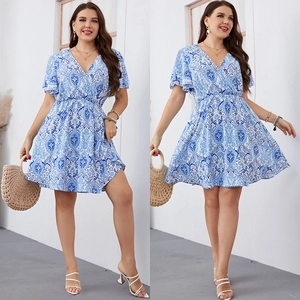 Plus size blue paisley print summer dress with V-neckline and tiered ruffle skirt