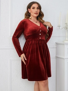 Detail of elegant V-neck wine red velvet dress with decorative white buttons and high waist