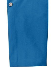 Detail of bright blue suit jacket fabric featuring a brown button and neat stitching