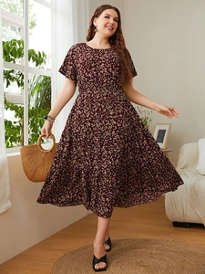 Close-up of floral print pattern on a vintage style plus size dark red summer dress