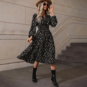 Detailed view of the V-neck and button closure on the floral long sleeve midi dress