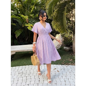 Detail of light purple floral V-neck dress featuring ruffle sleeves and high elastic waist