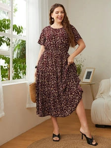 Detail of burgundy floral print maxi dress with tiered skirt and short sleeves
