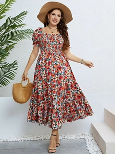 Detail of smocking chest and puff sleeves on a floral summer midi dress