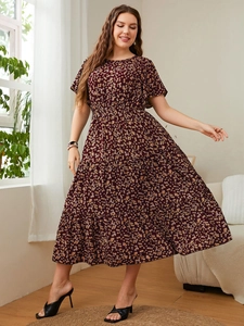Detailed macro view of the layered ruffle hem on the burgundy floral plus-size dress