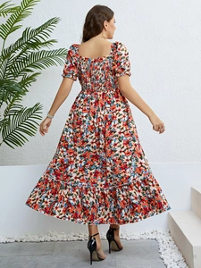 Detail of smocked back design and large floral print on summer off-shoulder midi dress