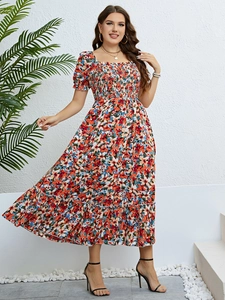 Detail of floral maxi dress showing the smocked bodice and square neckline design