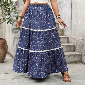 Detail view of tiered floral maxi skirt with lace trim and elegant ruffled layers