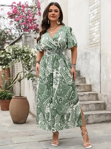 Detail of bohemian floral maxi dress featuring high slit and green abstract pattern