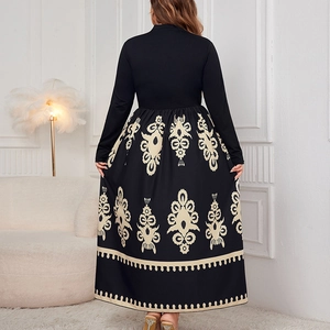 Back view of a high waist maxi dress featuring an elegant ethnic pattern and long sleeves