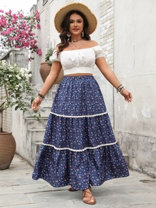 Close-up of three-layered floral skirt with delicate white lace trim on the hemline