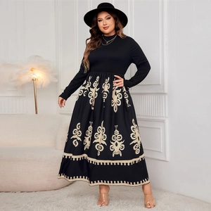 Detail view of high waist maxi dress with black bodice and beige totem print skirt