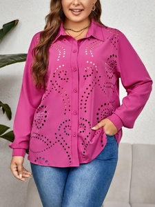 Close-up of elegant rose red long sleeve shirt featuring intricate hollow-out floral patterns