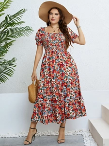 Detail of floral off-shoulder maxi dress with smocking waist and puff sleeves for summer