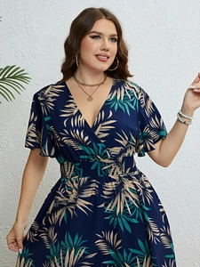 Detail view of V-neck summer dress featuring tropical leaf print and ruffled sleeves