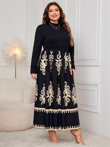 Detail of plus size black long-sleeve maxi dress with beige floral totem pattern