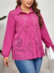 Detail of laser-cut hollow pattern and collar on magenta long sleeve shirt