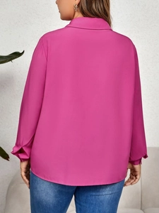 Rear view of rose red loose long-sleeve blouse with stylish hollow-out details