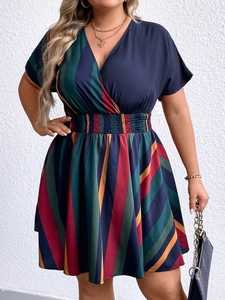 Detail of plus size V-neck dress with colorful vertical stripes and elastic waist