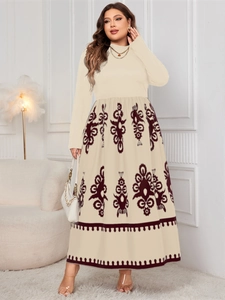 Close-up of ethnic totem print pattern on a high-waisted beige long-sleeved dress