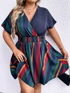 Detail of V-neckline and elastic waist on plus size striped short sleeve dress
