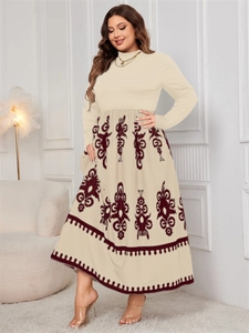Detail of high-waist maxi dress featuring a beige bodice and ethnic totem print skirt