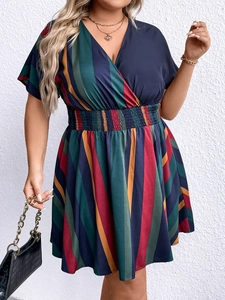 Detail of V-neckline and colorful vertical stripes on a plus size summer dress