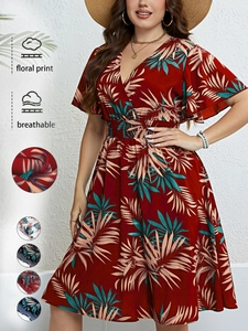 Detail view of V-neck floral dress with palm leaf print and breathable fabric options