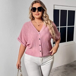 Pink linen V-neck short-sleeve shirt with buttons and natural textured fabric for women