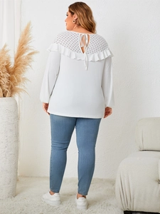Detailed back view of a white lace knit top with elegant hollow out bow ties and long sleeves
