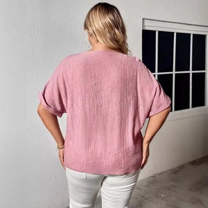 Women's loose V-neck linen shirt in dusty rose with textured vertical pleats and roll-up sleeves