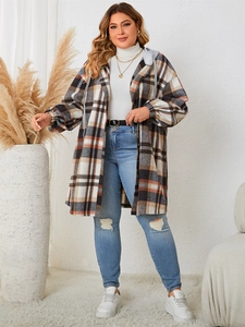 Detail of oversized plaid hooded jacket with brown and blue patterns and grey hood