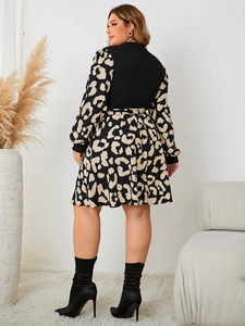 Detail view of the long sleeve leopard print patchwork dress showing the back and silhouette